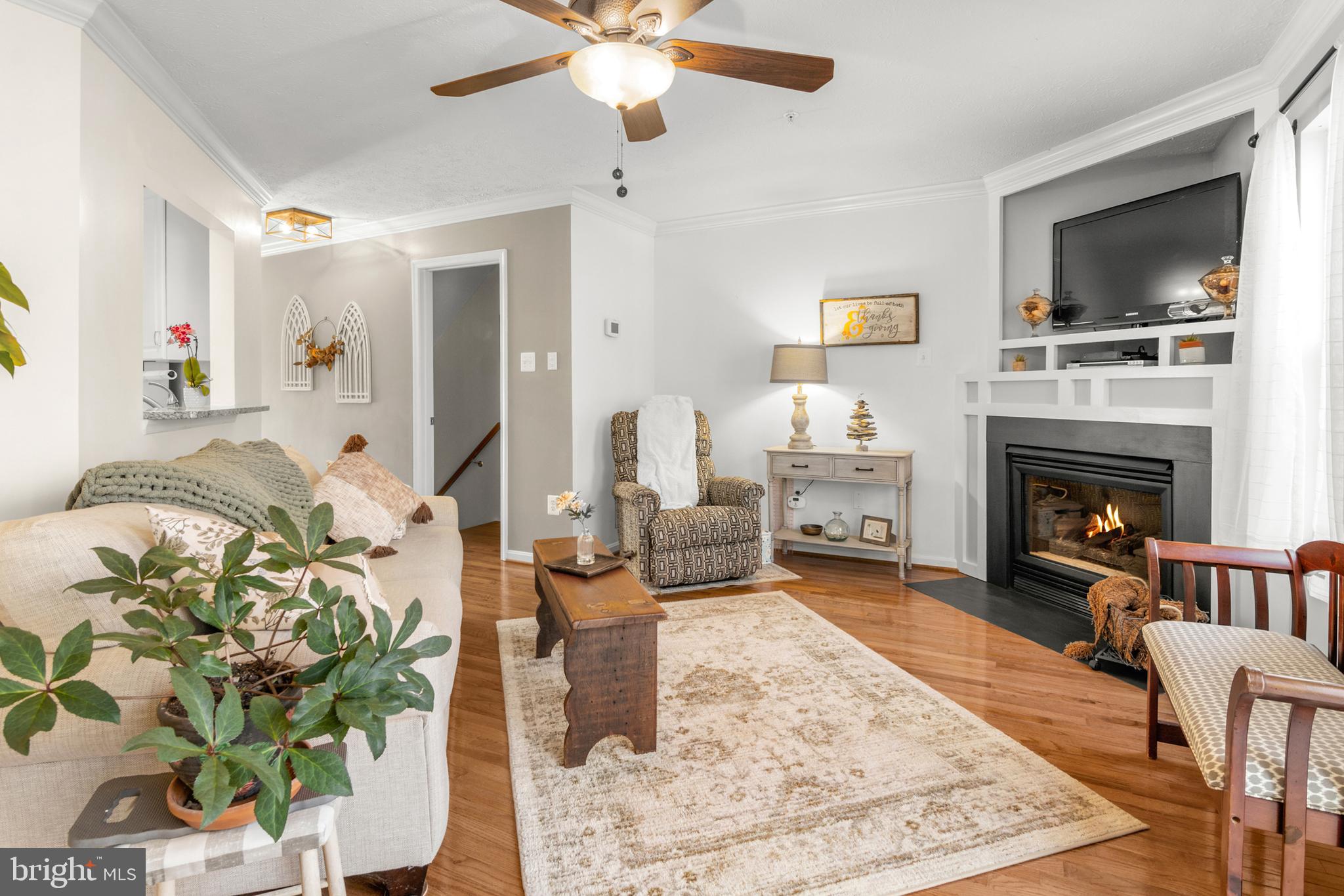1447 Falcon Nest Court, Unit 45 Arnold, MD 21012 - Photo 24 of 58 a living room with furniture fireplace and flat screen tv