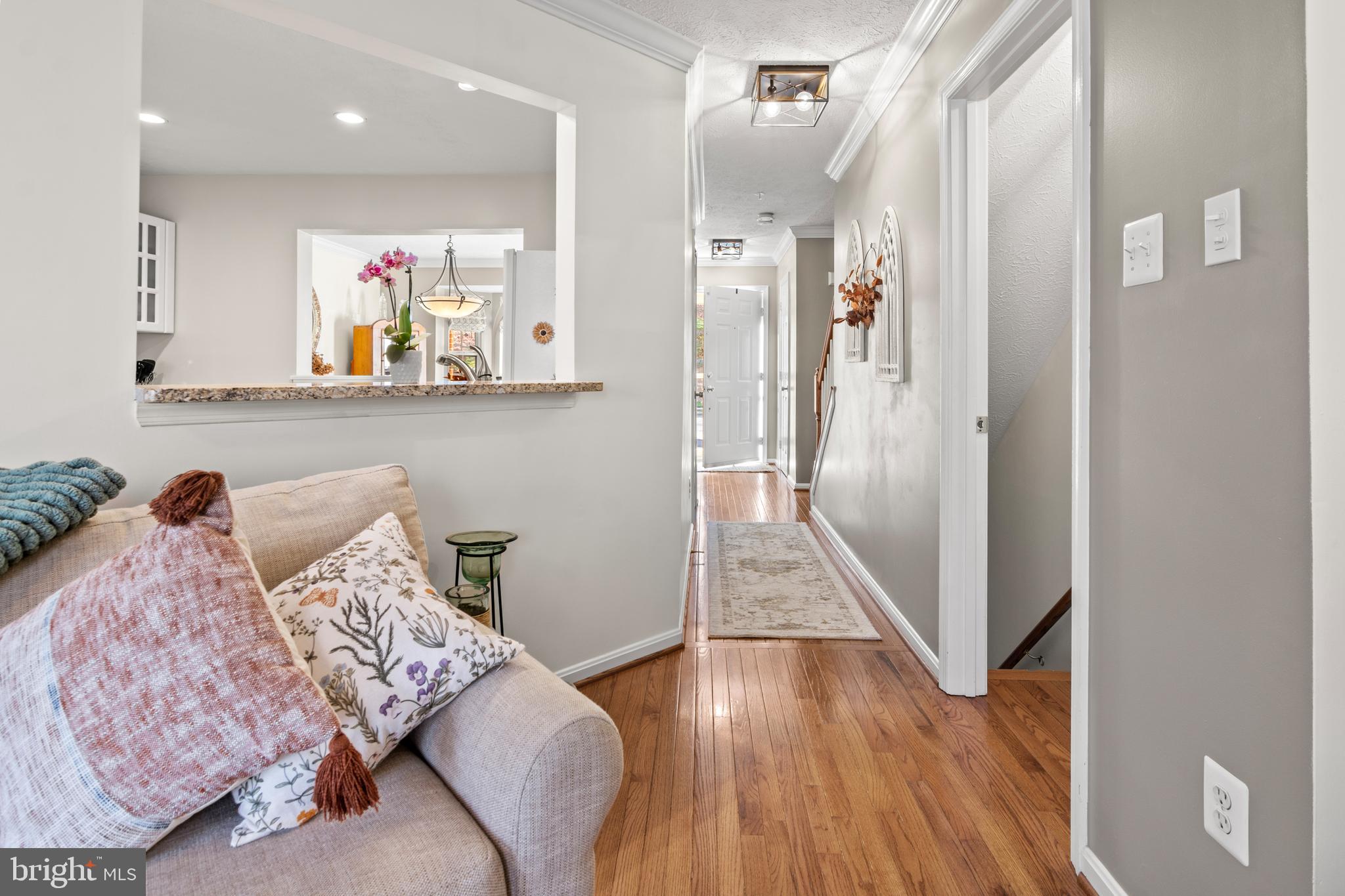 1447 Falcon Nest Court, Unit 45 Arnold, MD 21012 - Photo 28 of 58 a living room with furniture and a wooden floor