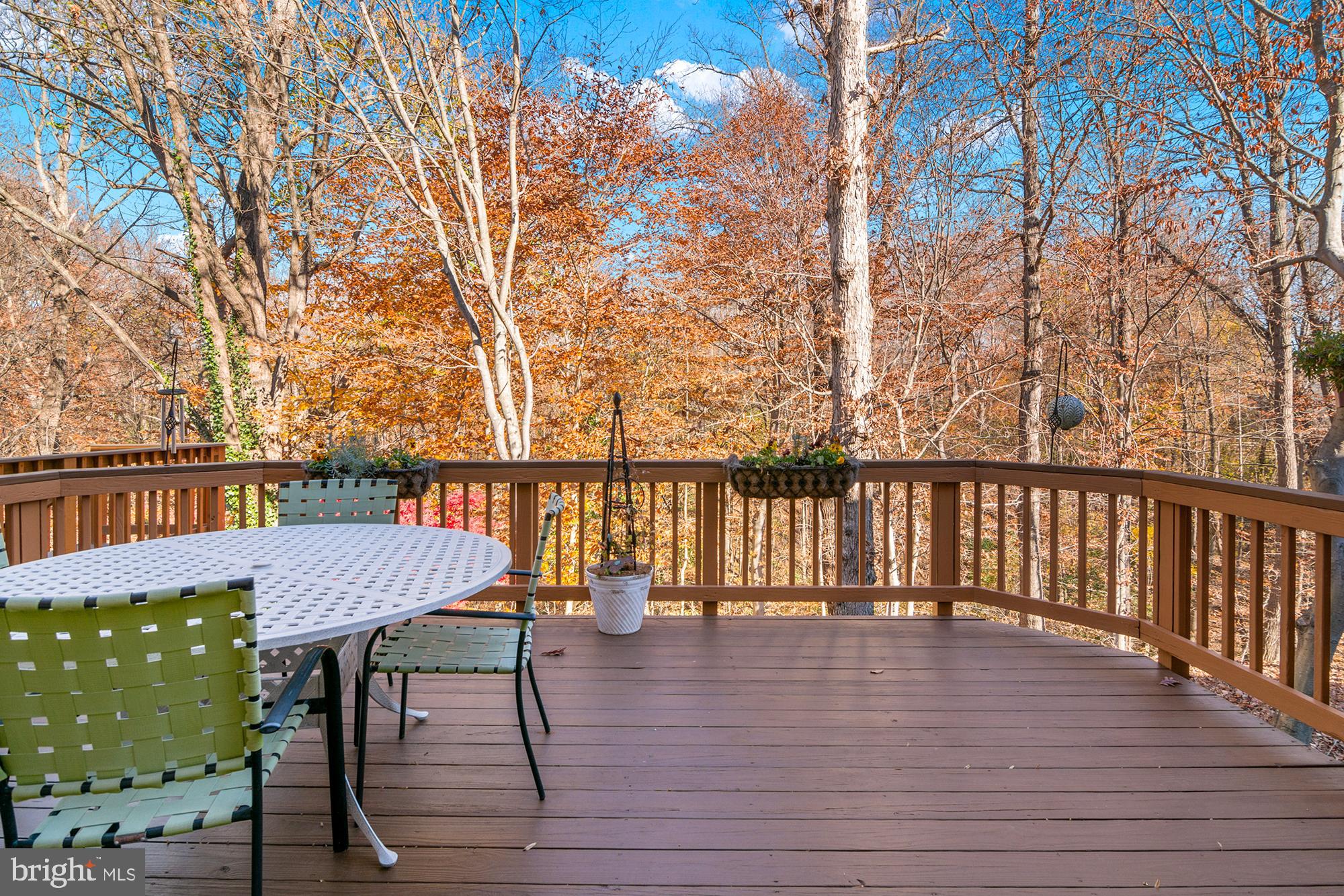 1447 Falcon Nest Court, Unit 45 Arnold, MD 21012 - Photo 3 of 58 a view of a deck with table and chairs and wooden floor