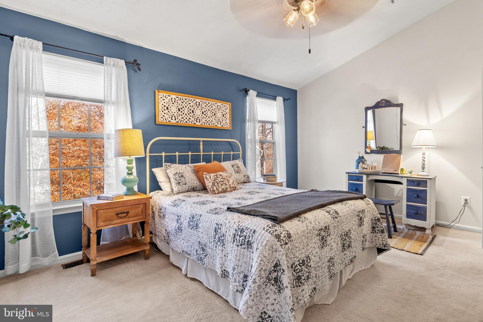 1447 Falcon Nest Court, Unit 45 Arnold, MD 21012 - Photo 33 of 58 a bedroom with a bed and a chandelier