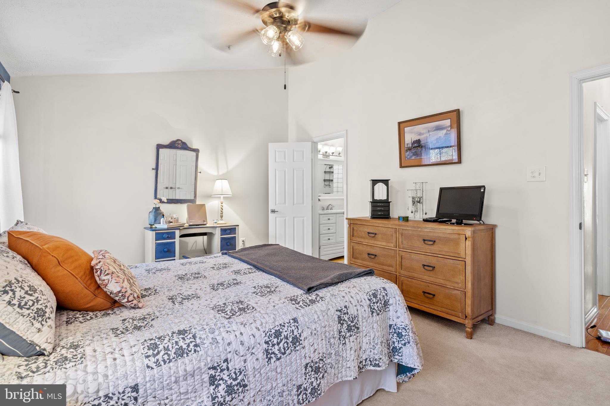 1447 Falcon Nest Court, Unit 45 Arnold, MD 21012 - Photo 35 of 58 a bedroom with a bed and a dresser