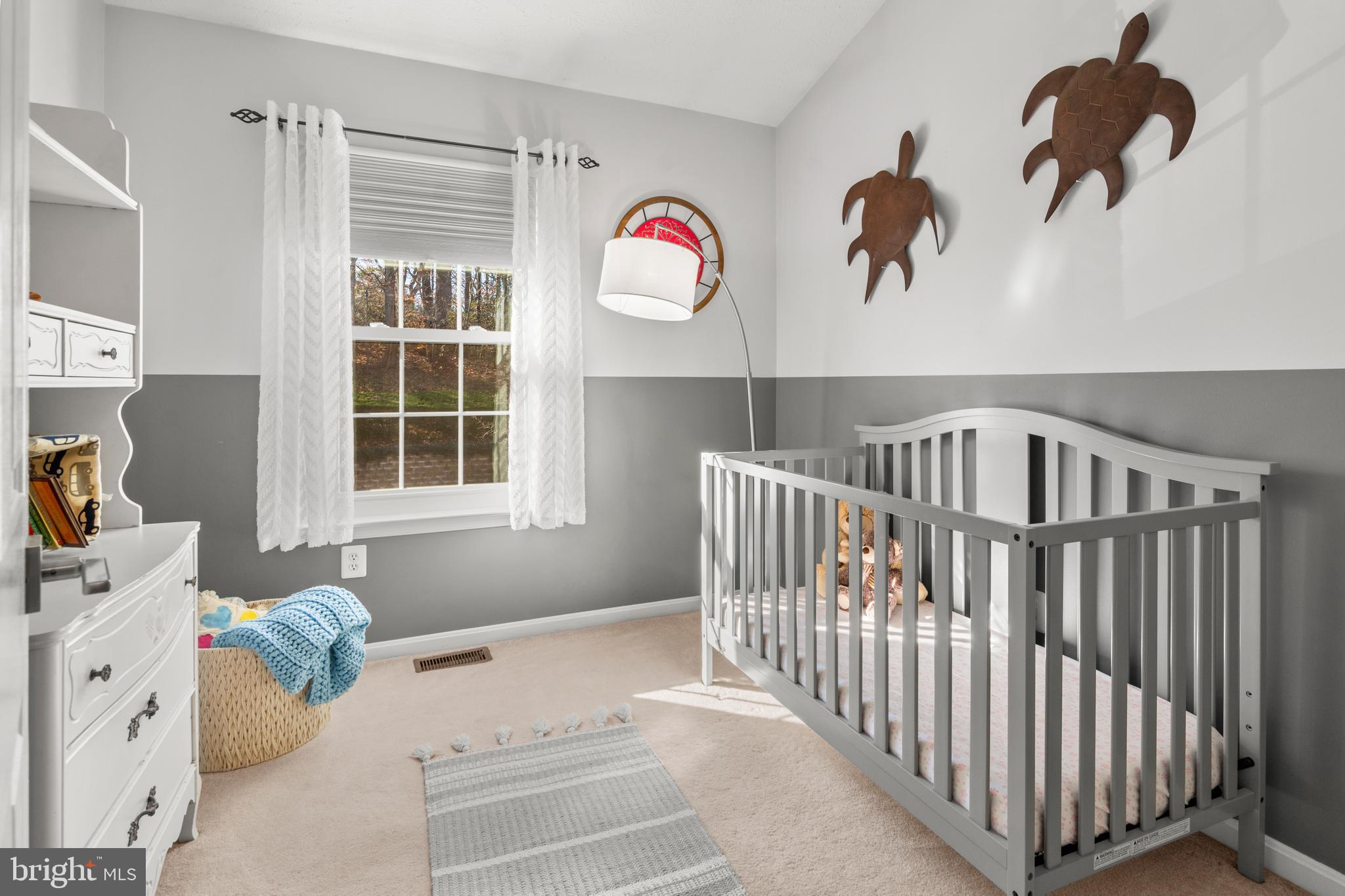 1447 Falcon Nest Court, Unit 45 Arnold, MD 21012 - Photo 41 of 58 a bedroom with a bed and a window