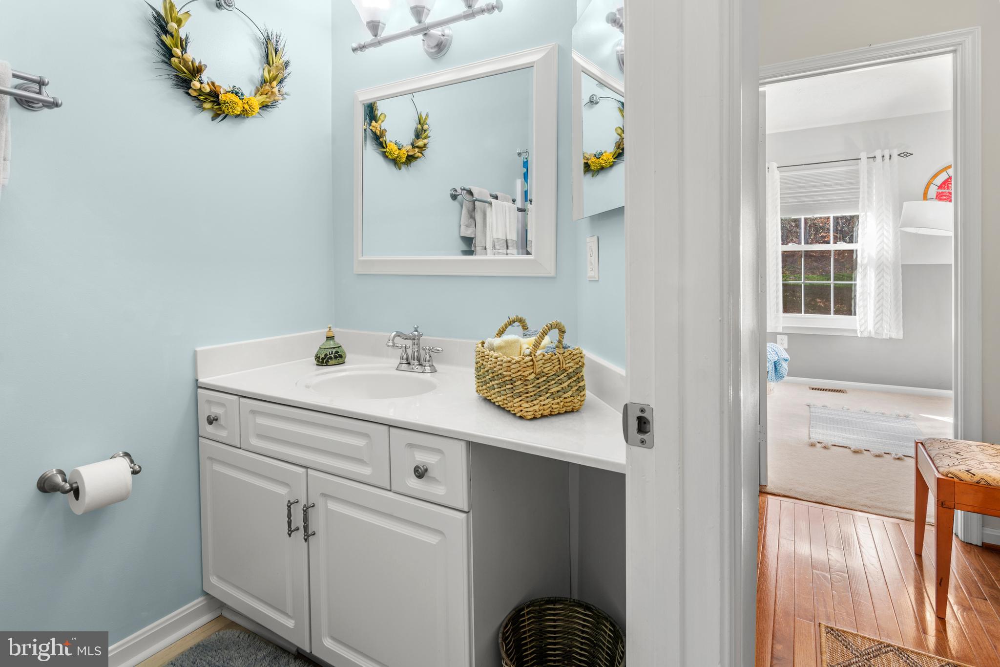 1447 Falcon Nest Court, Unit 45 Arnold, MD 21012 - Photo 46 of 58 a bathroom with a sink and a mirror