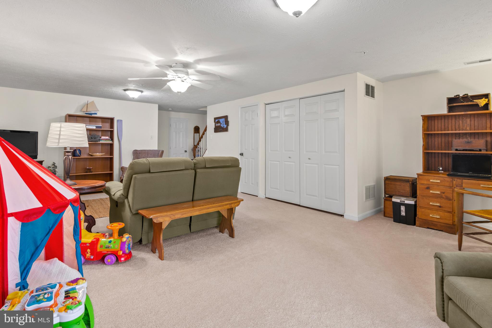 1447 Falcon Nest Court, Unit 45 Arnold, MD 21012 - Photo 49 of 58 a living room with furniture and a flat screen tv