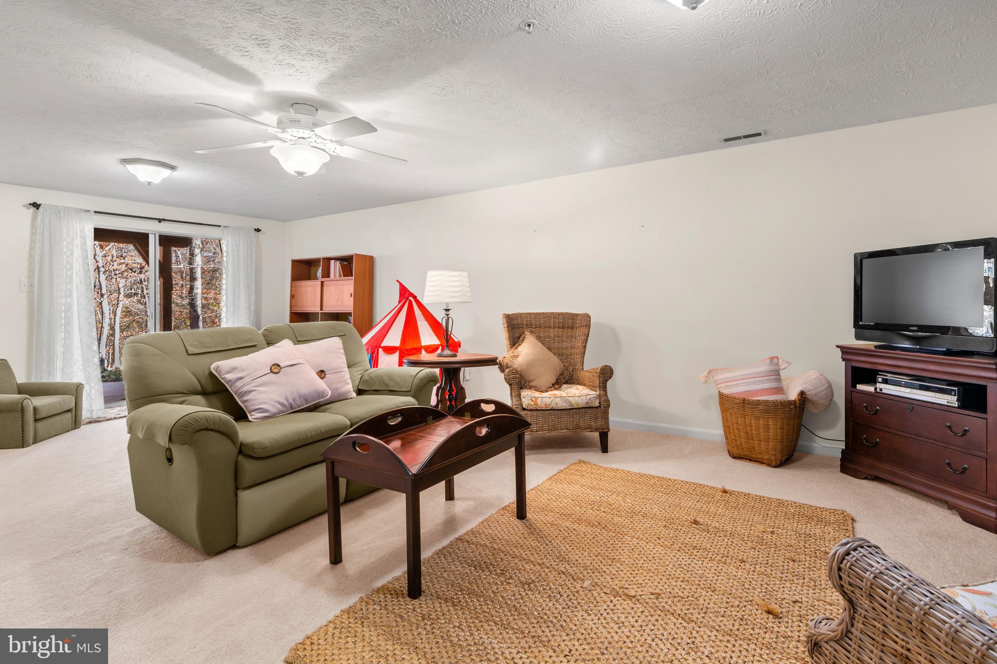 1447 Falcon Nest Court, Unit 45 Arnold, MD 21012 - Photo 50 of 58 a living room with furniture and a flat screen tv