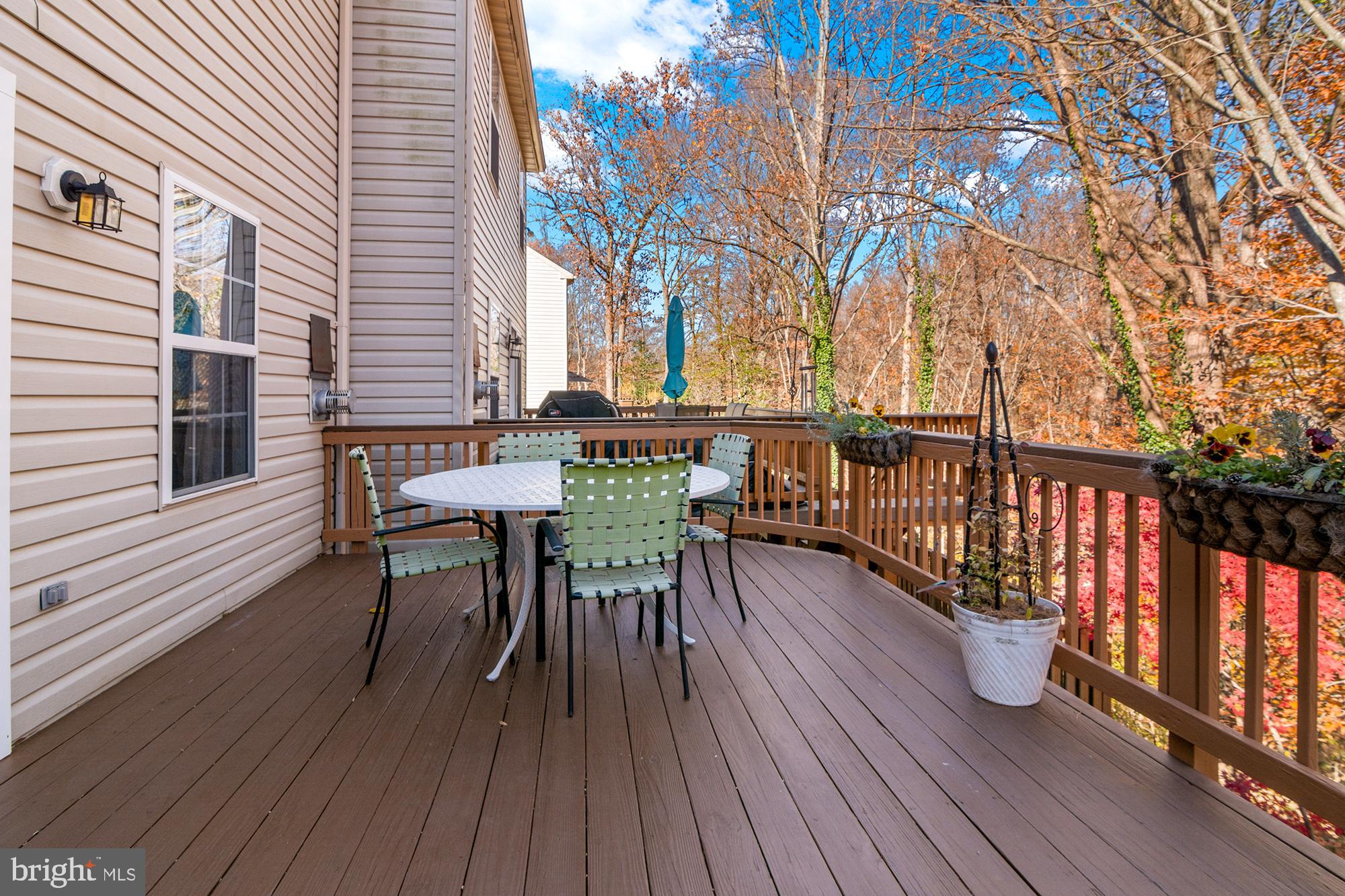 1447 Falcon Nest Court, Unit 45 Arnold, MD 21012 - Photo 57 of 58 a view of a roof deck with table and chairs and wooden floor