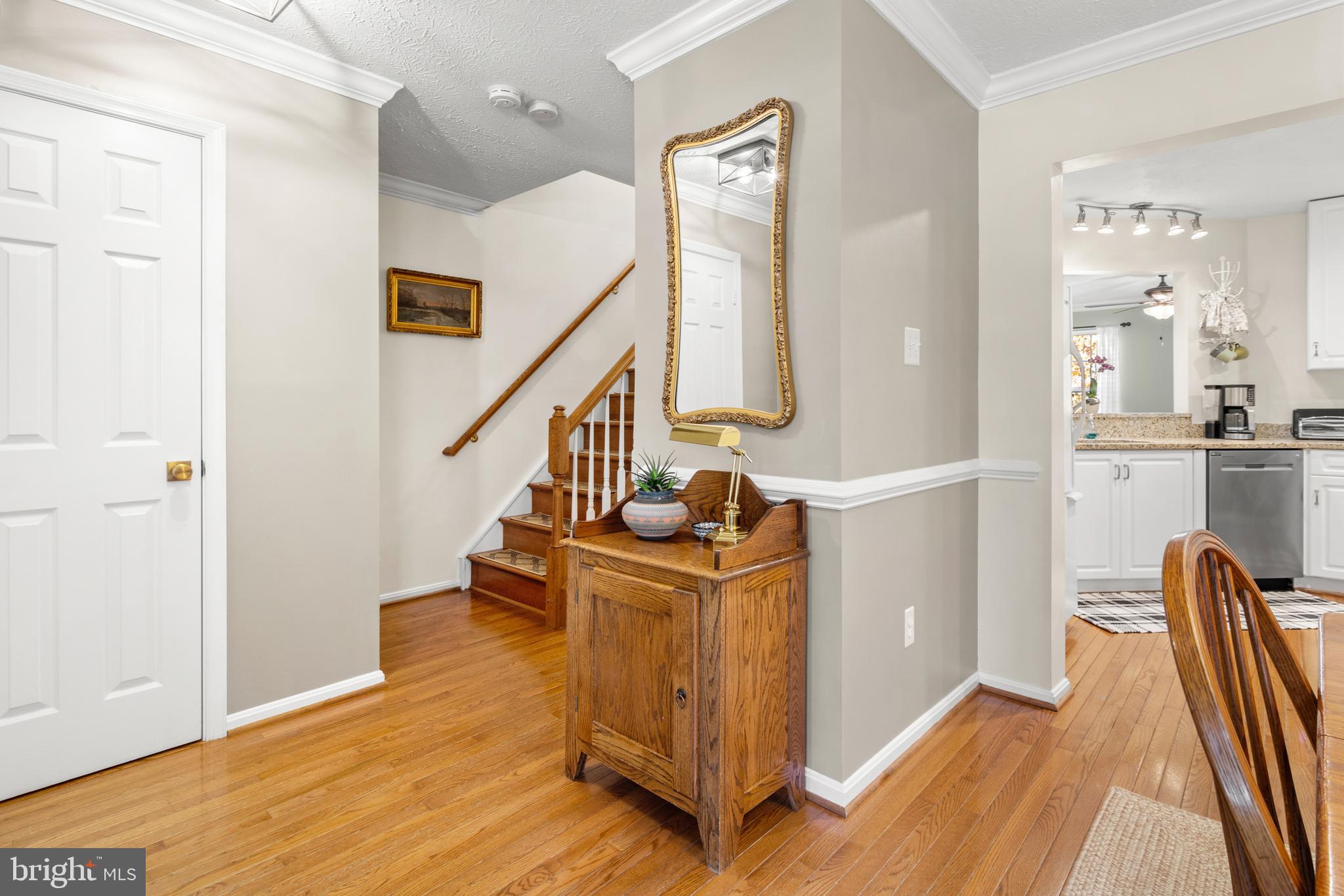 1447 Falcon Nest Court, Unit 45 Arnold, MD 21012 - Photo 7 of 58 a view of a hallway with wooden floor and staircase