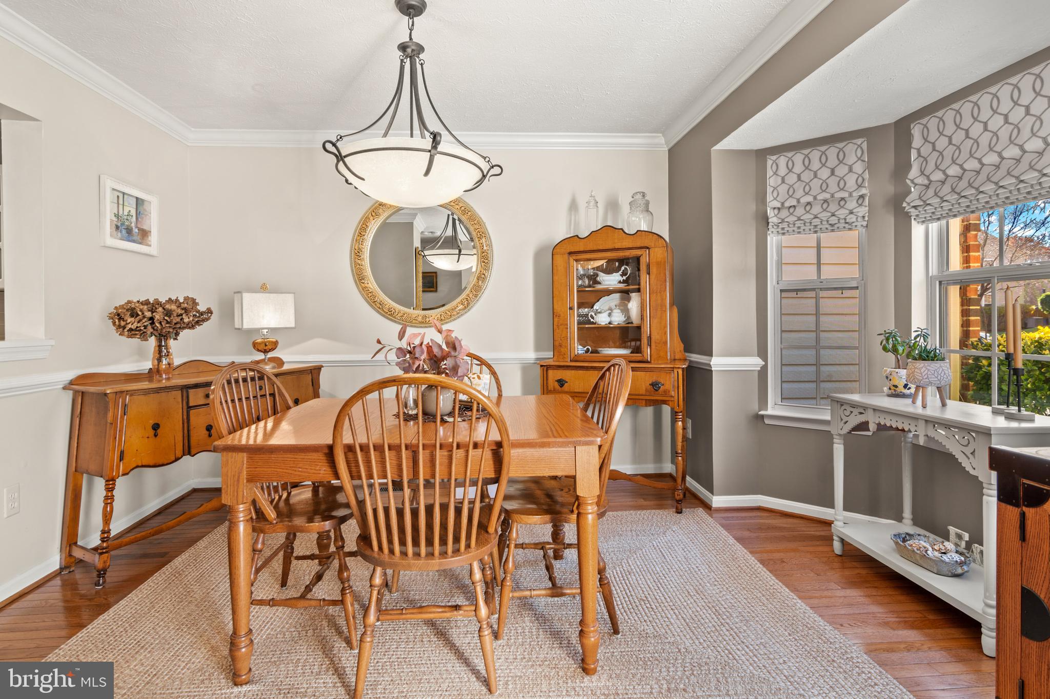 1447 Falcon Nest Court, Unit 45 Arnold, MD 21012 - Photo 10 of 58 a view of a dining room with furniture window and wooden floor