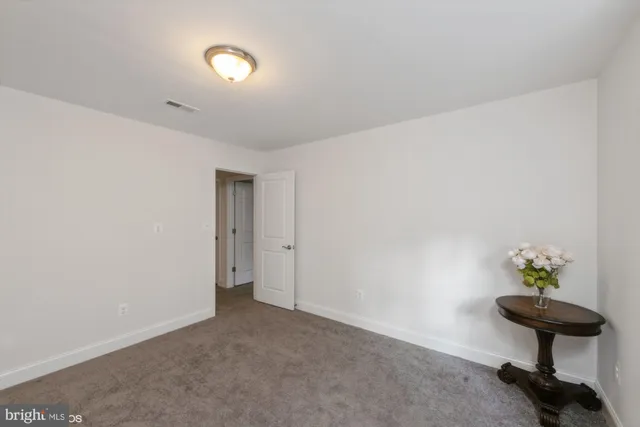 a view of an empty room and a window