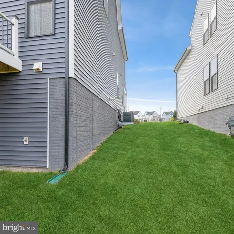 a view of a backyard with potted plants