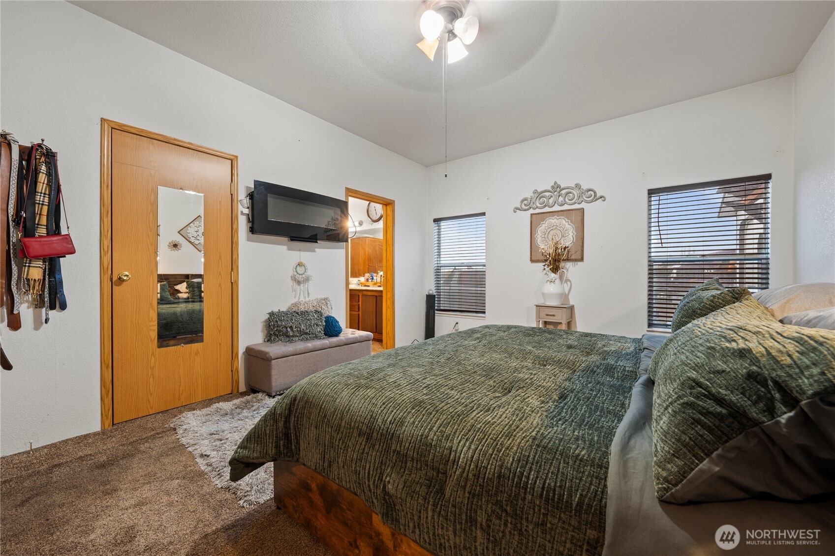 2211 Sielaff Road Othello, WA 99344 - Photo 18 of 37 a bedroom with a bed and a chandelier