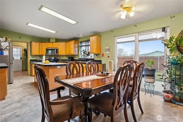 a view of a dining room with furniture window and outside view