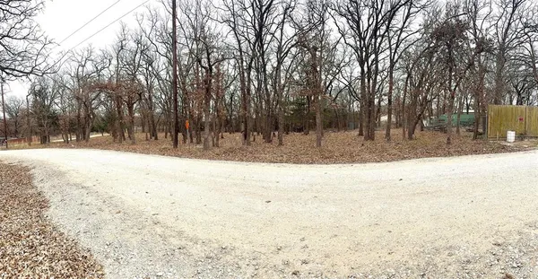 a view of snow on the side of the road