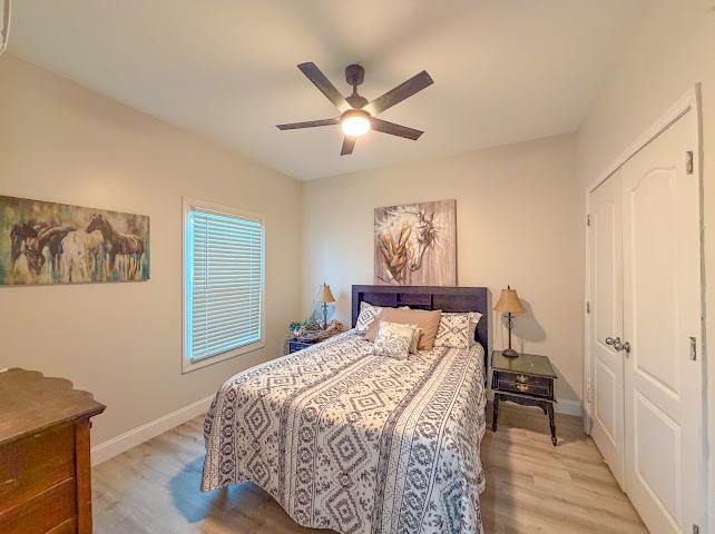 449 Miller Lane Goodspring, TN 38460 - Photo 13 of 20 a bedroom with a large bed and a chandelier