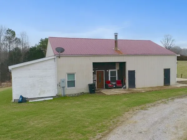 a view of a house with a backyard