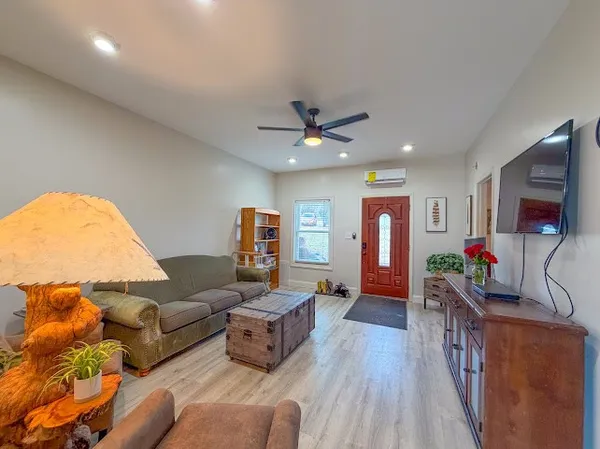 a bedroom with a bed and a television