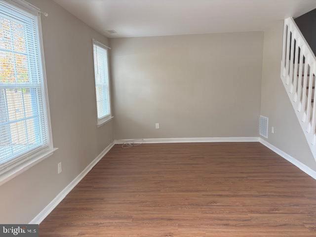 357 Brookdale Boulevard Williamstown, NJ 08094 - Photo 11 of 28 a view of an empty room with wooden floor and a window