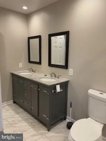 a bathroom with a sink and a toilet