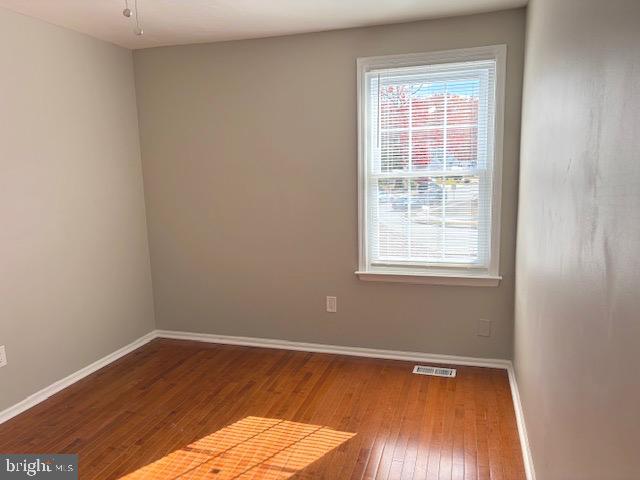 357 Brookdale Boulevard Williamstown, NJ 08094 - Photo 24 of 28 wooden floor in an empty room with a window
