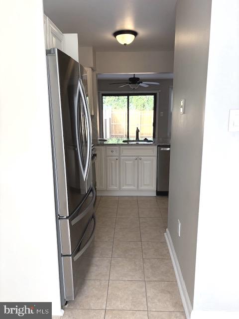 357 Brookdale Boulevard Williamstown, NJ 08094 - Photo 5 of 28 a kitchen with a refrigerator and window