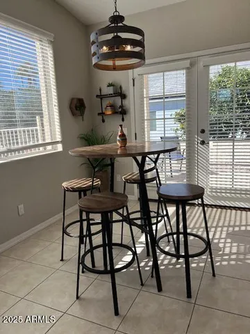 a view of a dining room with furniture and window