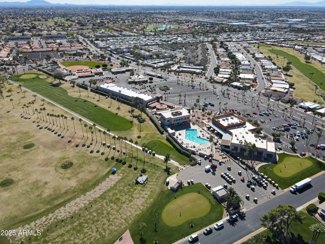 a view of a golf course with green space