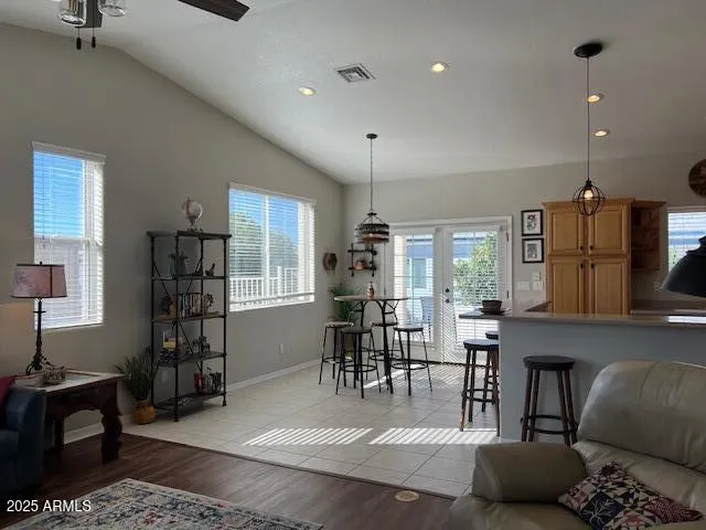 a living room with furniture and wooden floor