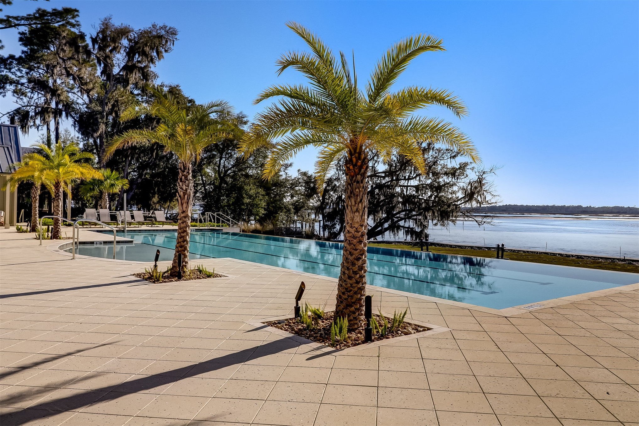 101 Broadbent Way Fernandina Beach, FL 32034 - Photo 22 of 29 a view of a swimming pool with a table and chairs