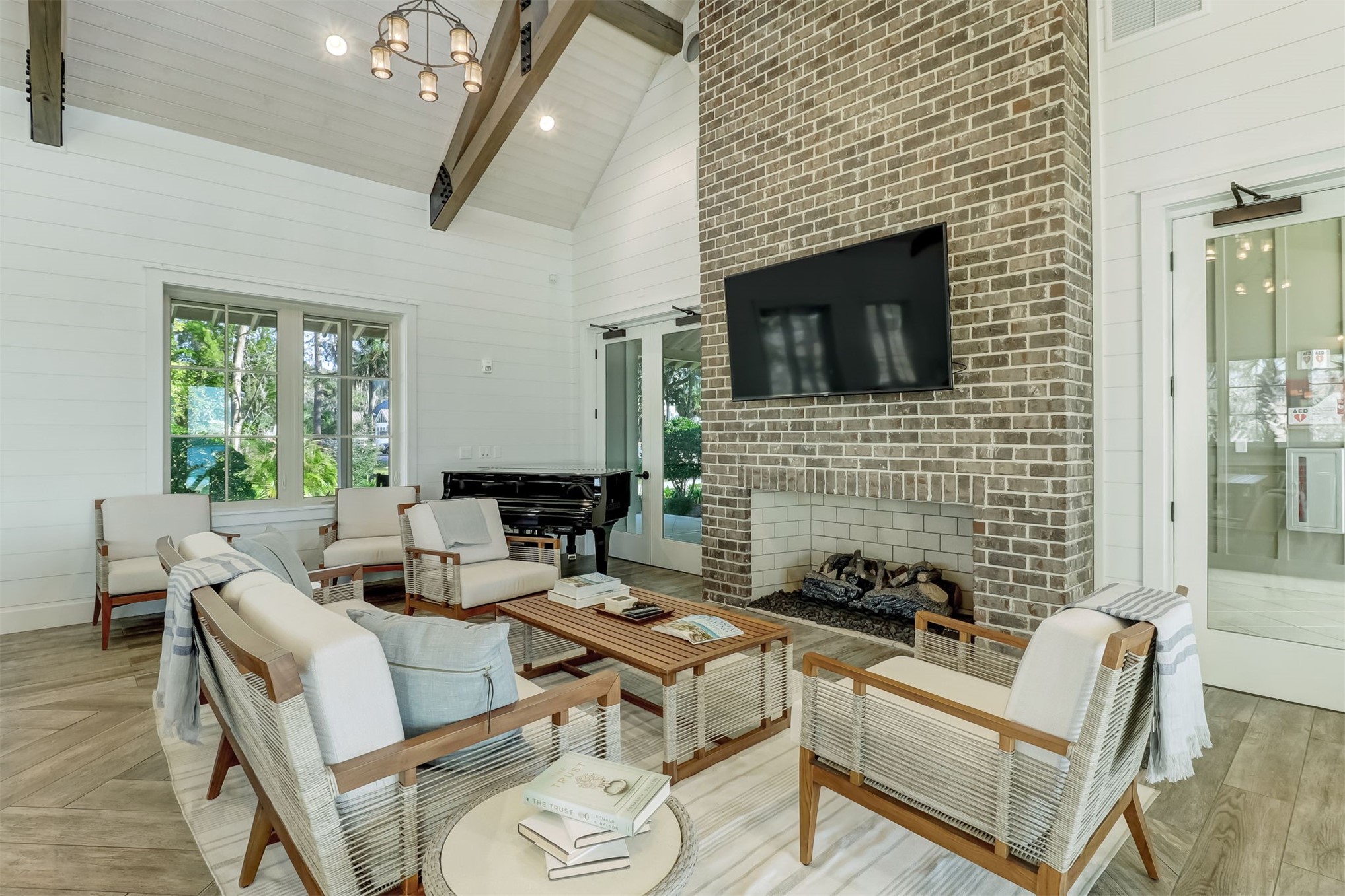101 Broadbent Way Fernandina Beach, FL 32034 - Photo 28 of 29 a living room with furniture a fireplace and a floor to ceiling window