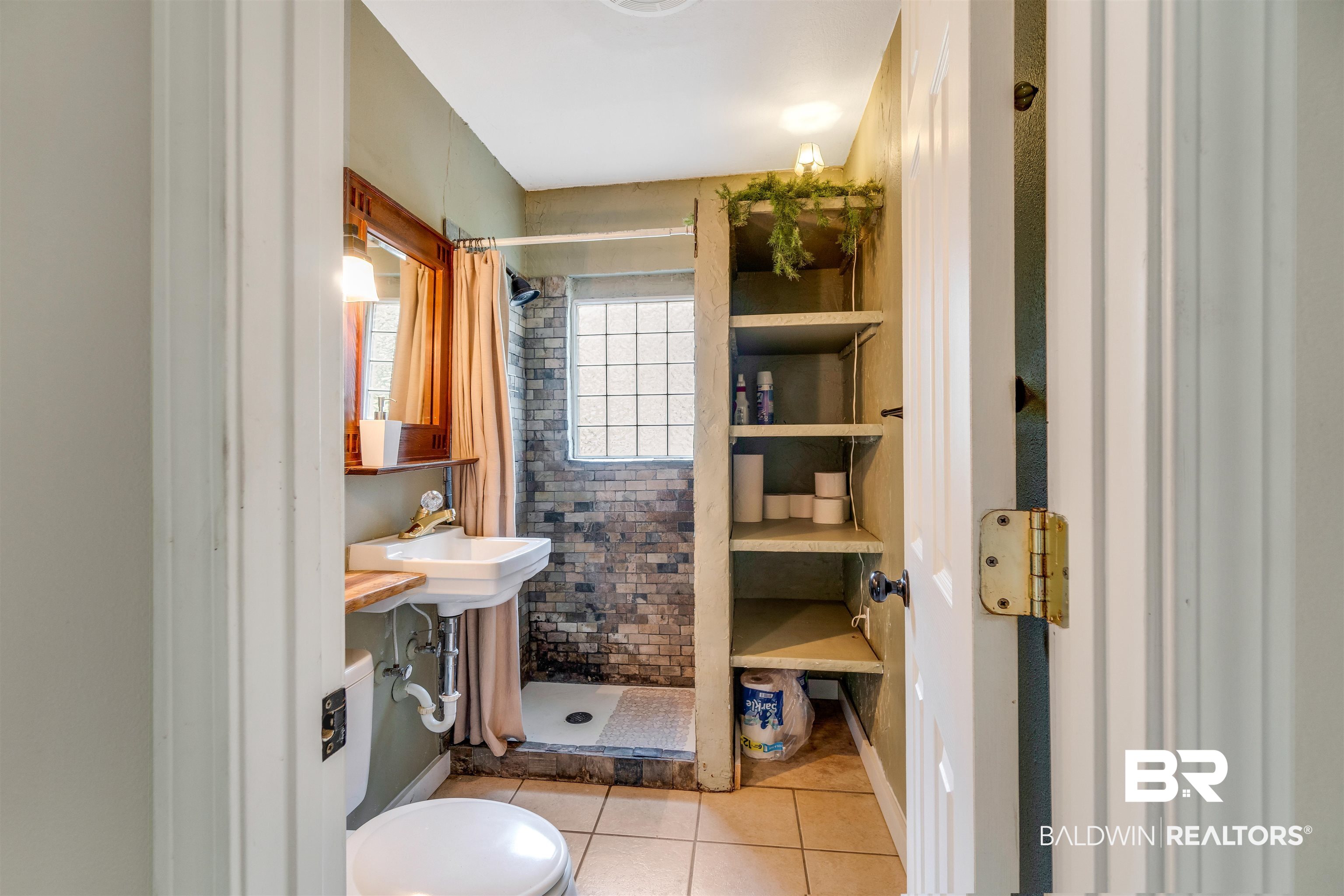 34341 Lost River Road Seminole, AL 36574 - Photo 13 of 36 Full bathroom featuring tiled shower and tile patterned flooring