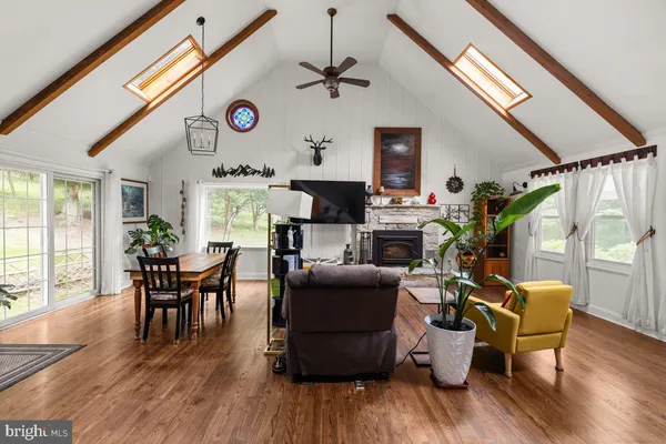 a workspace with wooden floor and windows