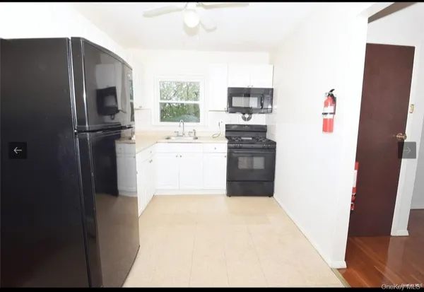 a kitchen with stainless steel appliances a refrigerator stove and sink