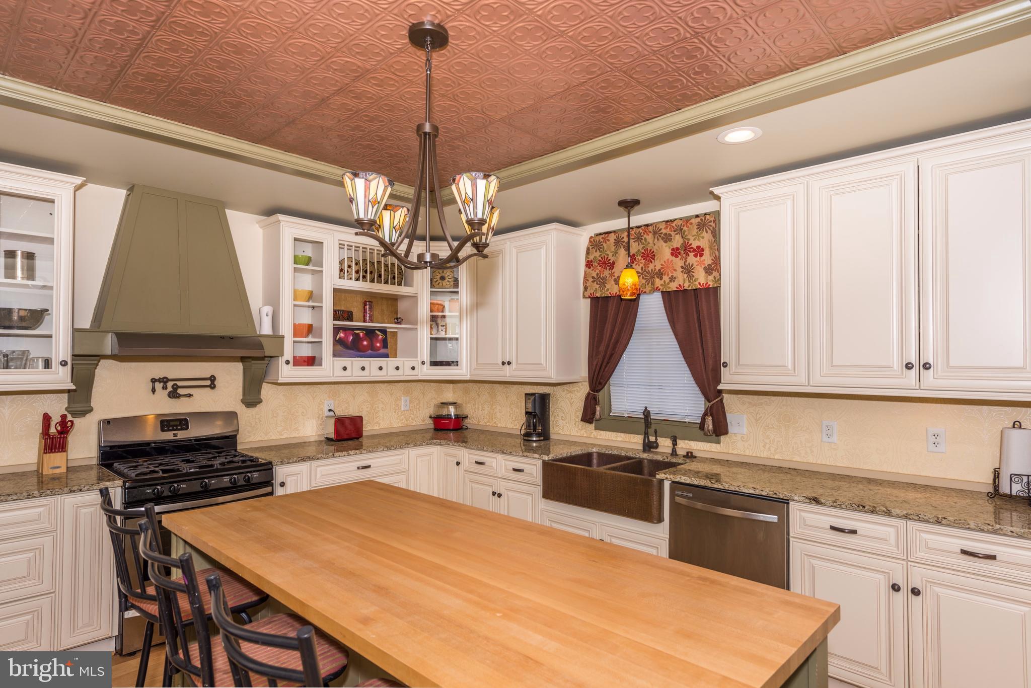 61 Mayfield Street Dover, PA 17315 - Photo 23 of 61 a open kitchen with stainless steel appliances granite countertop a stove top oven a sink dishwasher and white cabinets with wooden floor