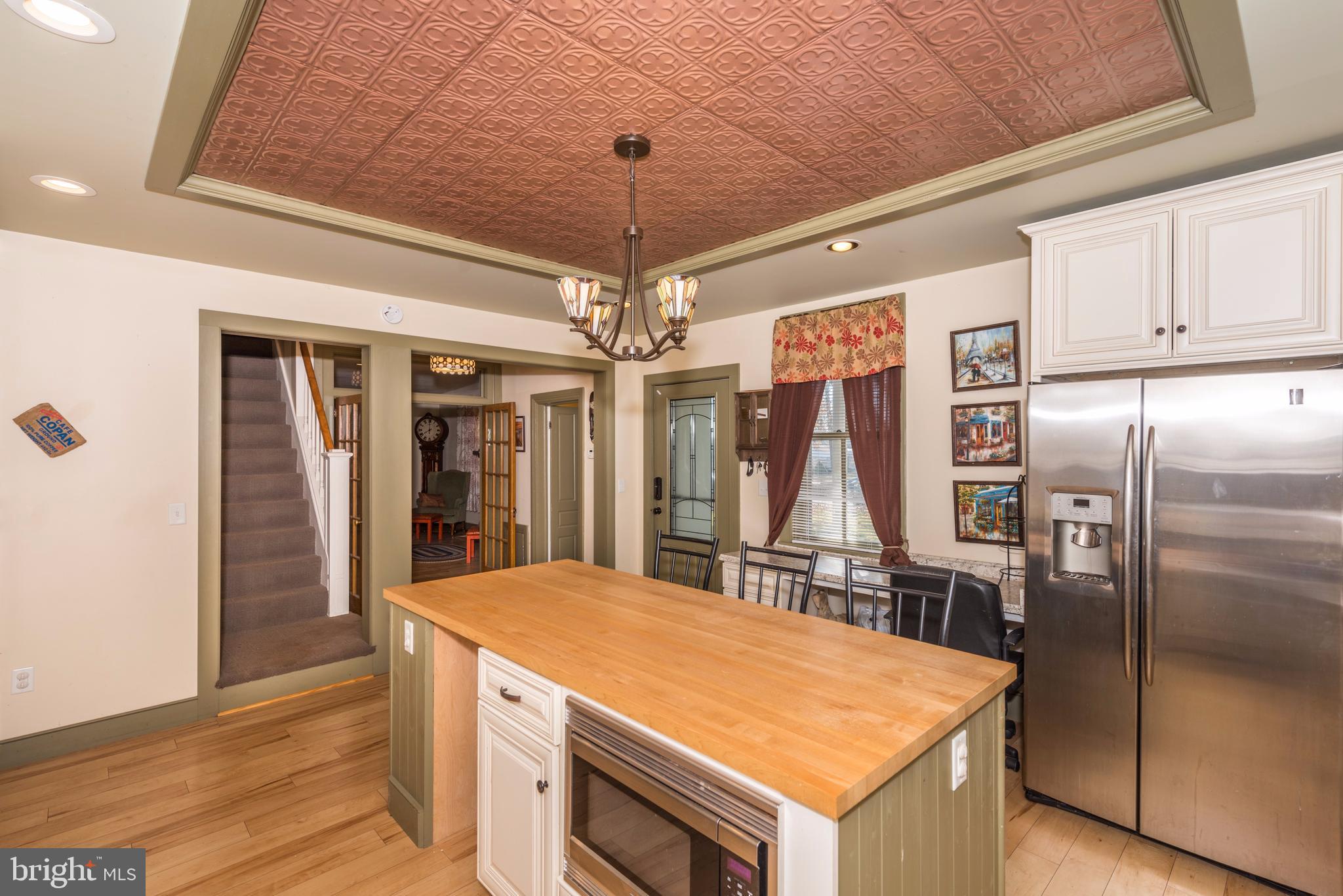 61 Mayfield Street Dover, PA 17315 - Photo 25 of 61 a kitchen with stainless steel appliances granite countertop a refrigerator a oven and a sink with wooden floor