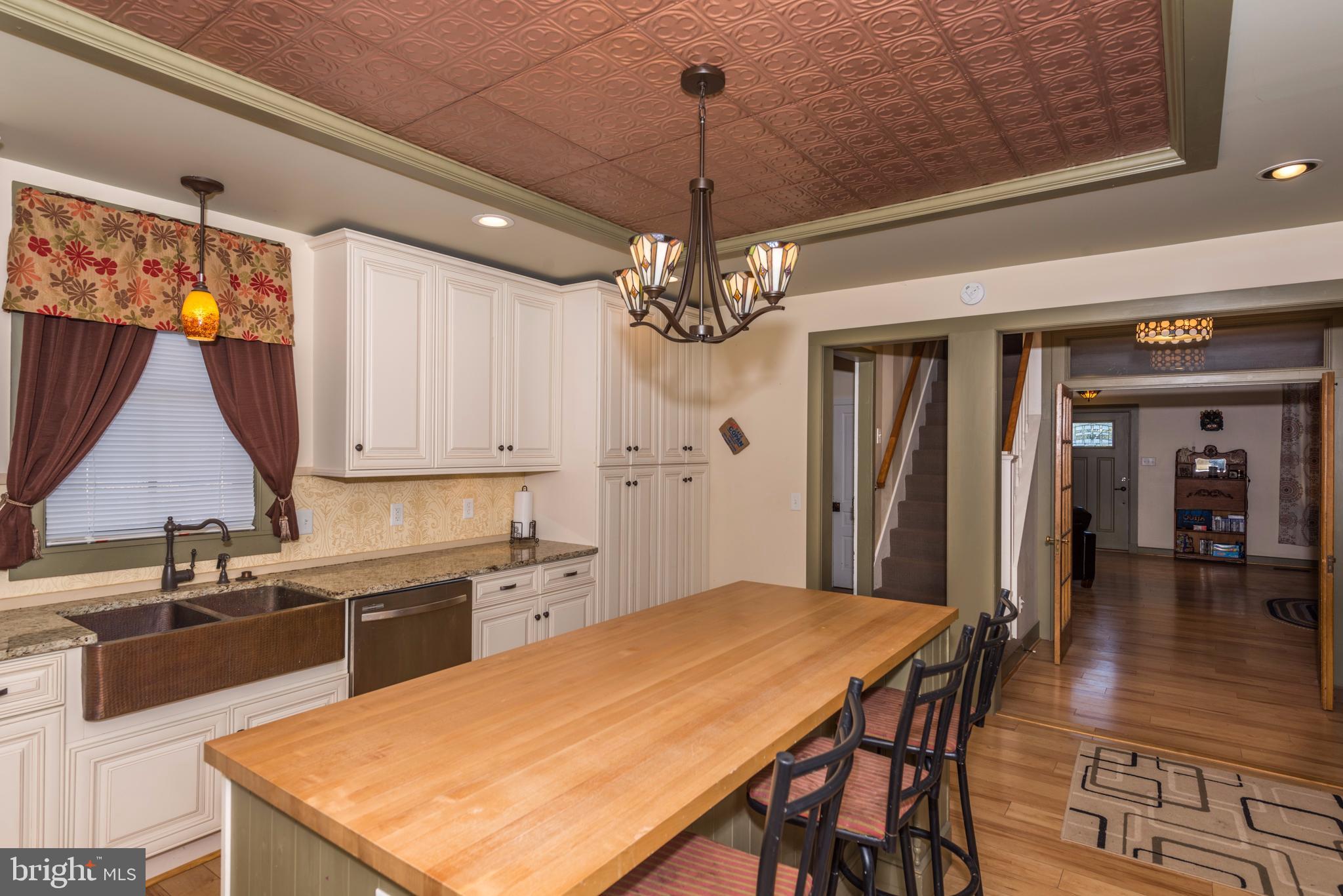 61 Mayfield Street Dover, PA 17315 - Photo 26 of 61 a kitchen with a table chairs and a chandelier