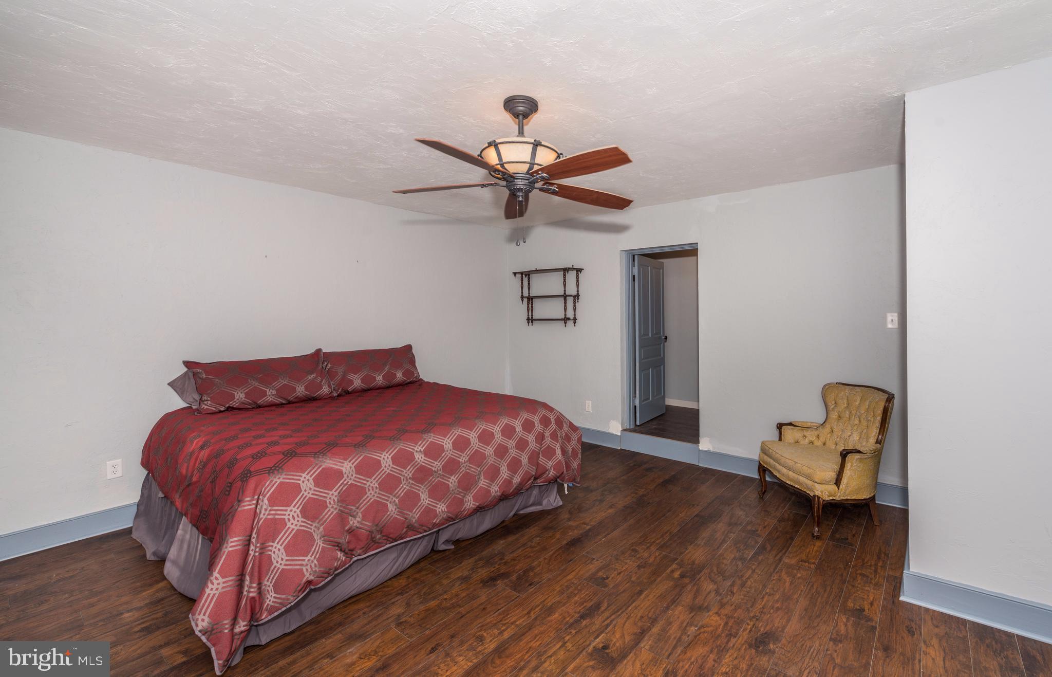 61 Mayfield Street Dover, PA 17315 - Photo 30 of 61 a bedroom with a bed and a chandelier