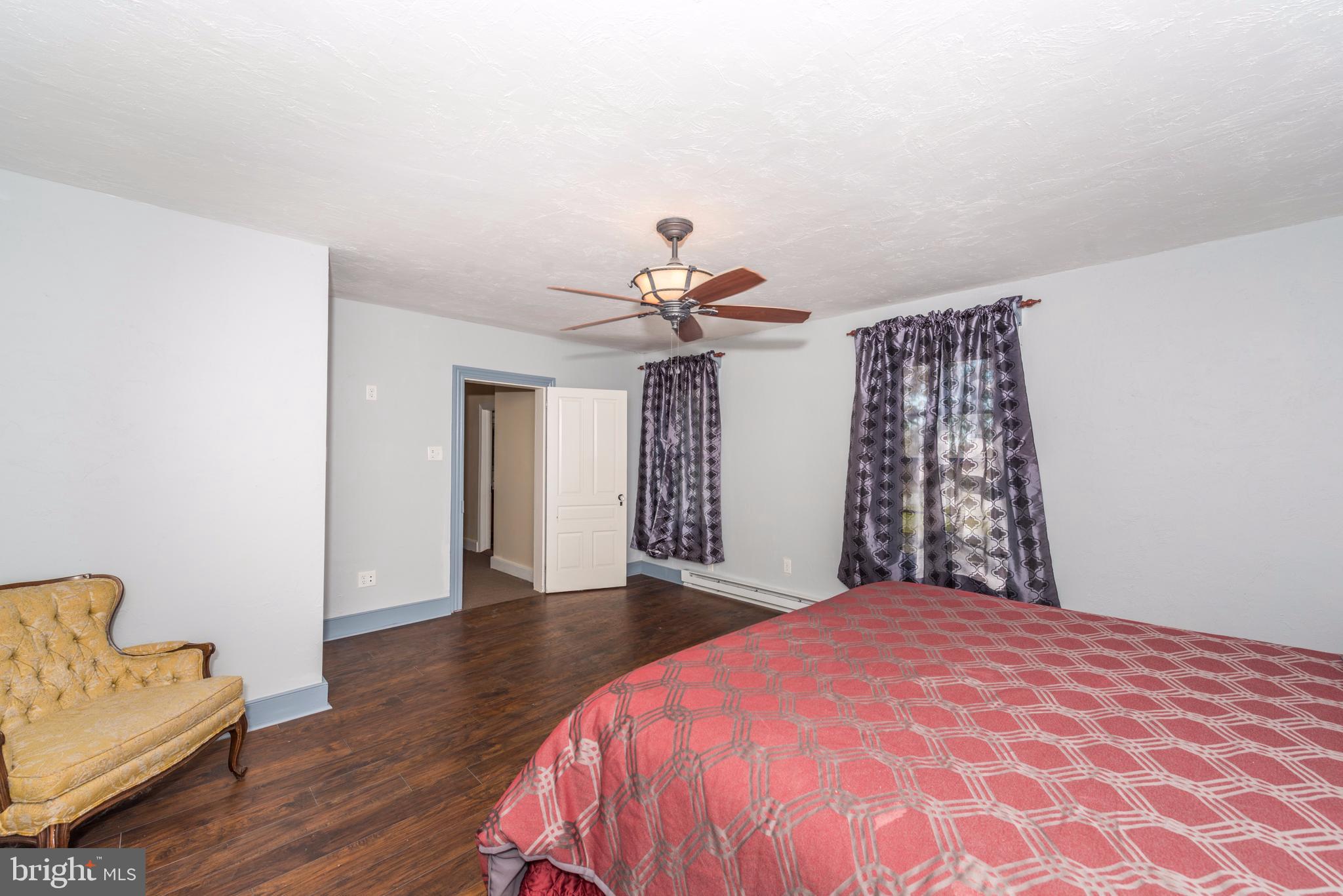 61 Mayfield Street Dover, PA 17315 - Photo 31 of 61 a bedroom with a bed and a chandelier