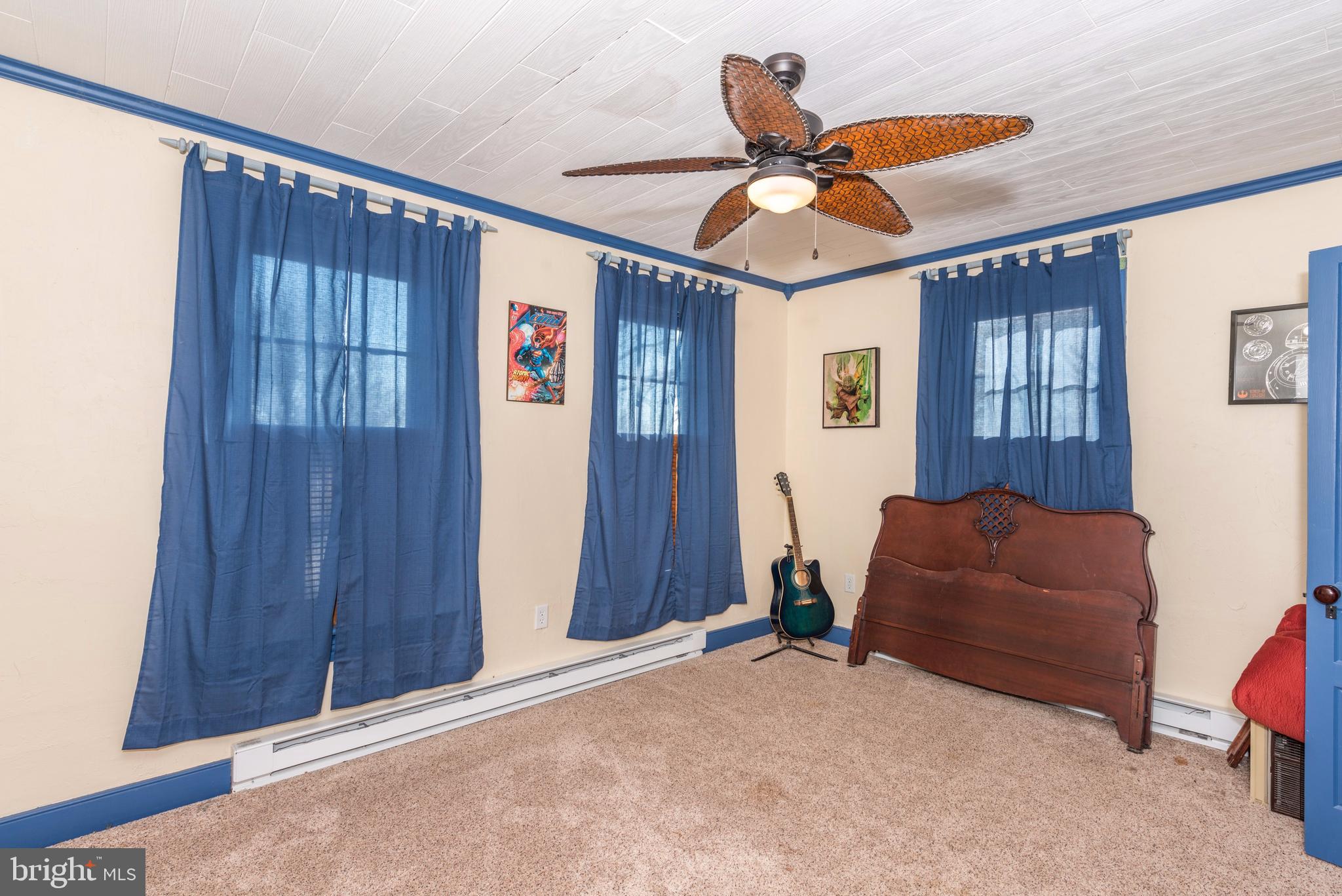 61 Mayfield Street Dover, PA 17315 - Photo 33 of 61 a blue bed sitting in a room next to a window