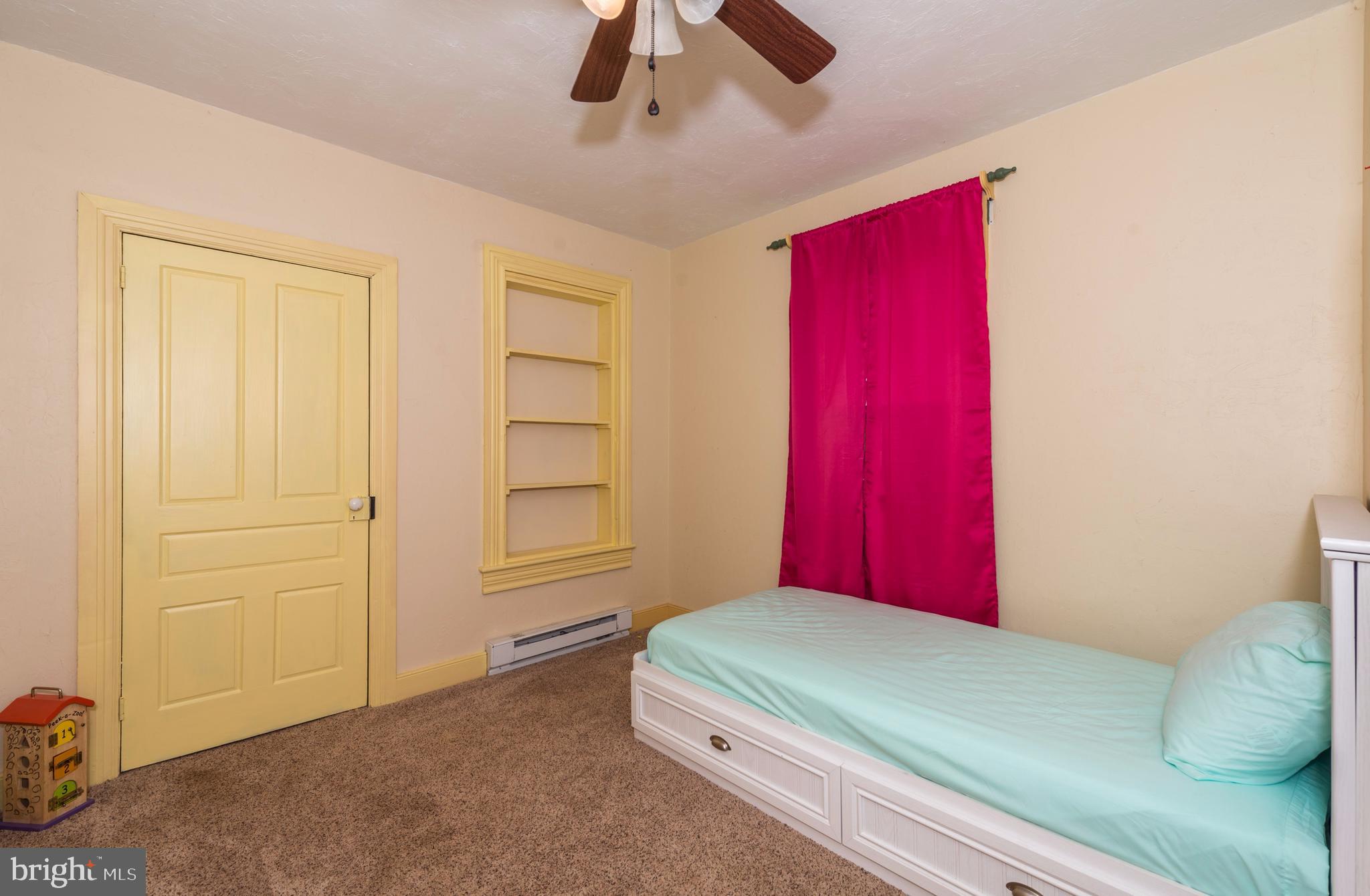 61 Mayfield Street Dover, PA 17315 - Photo 35 of 61 a bedroom with a bed and a chandelier