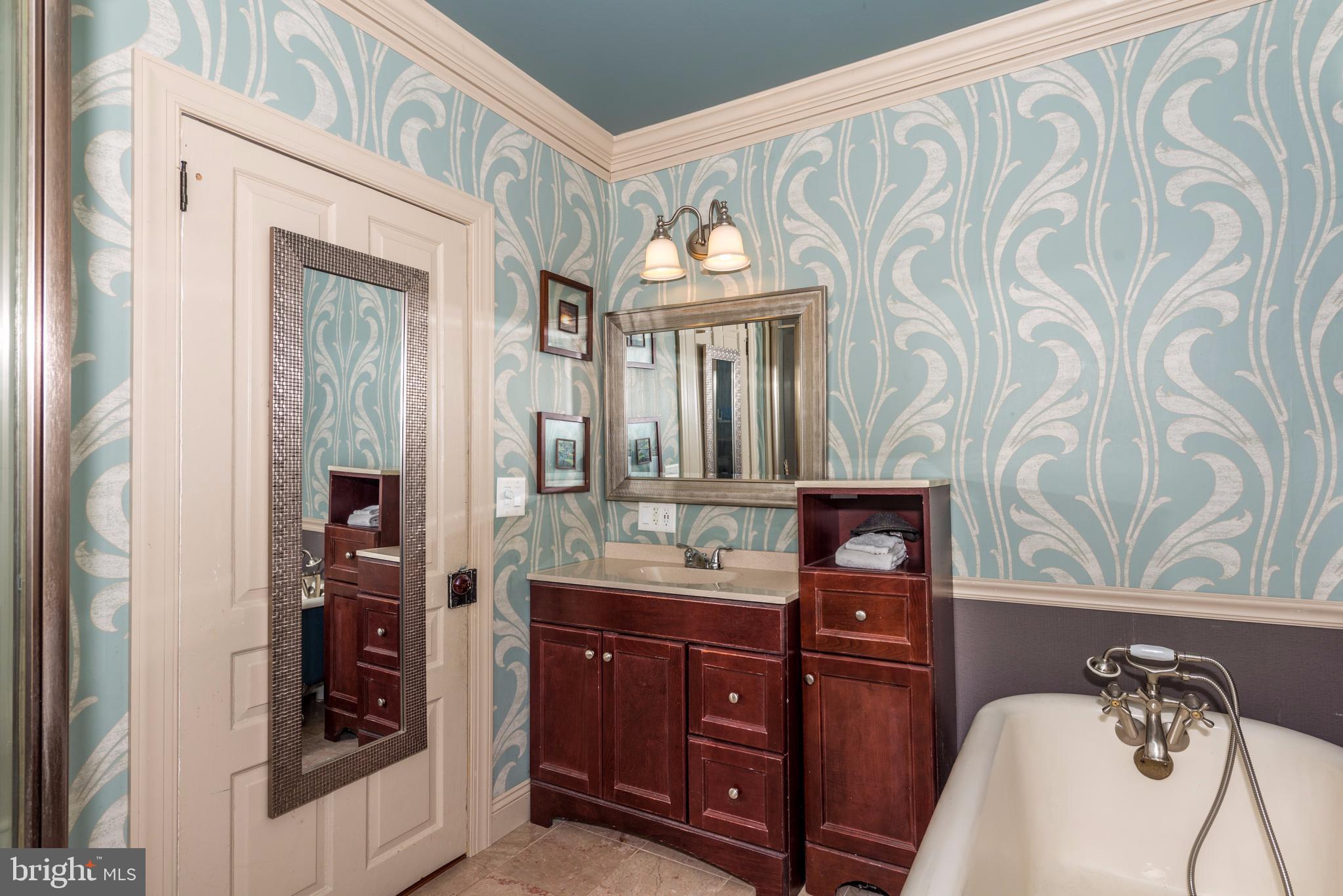 61 Mayfield Street Dover, PA 17315 - Photo 36 of 61 a bathroom with a granite countertop sink a mirror and a shower