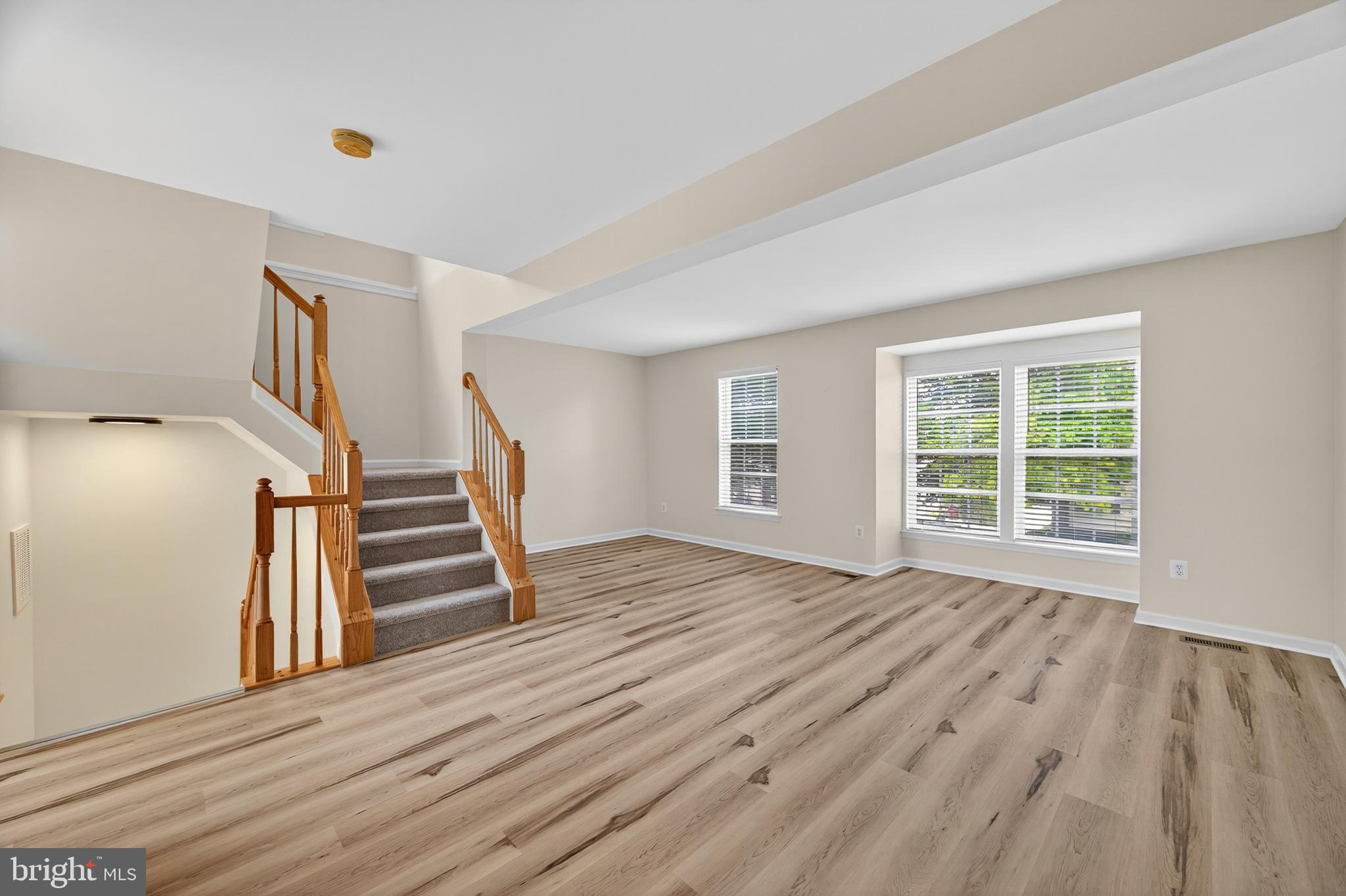 1337 Steed Street Ranson, WV 25438 - Photo 11 of 42 a view of wooden floor and windows in a room