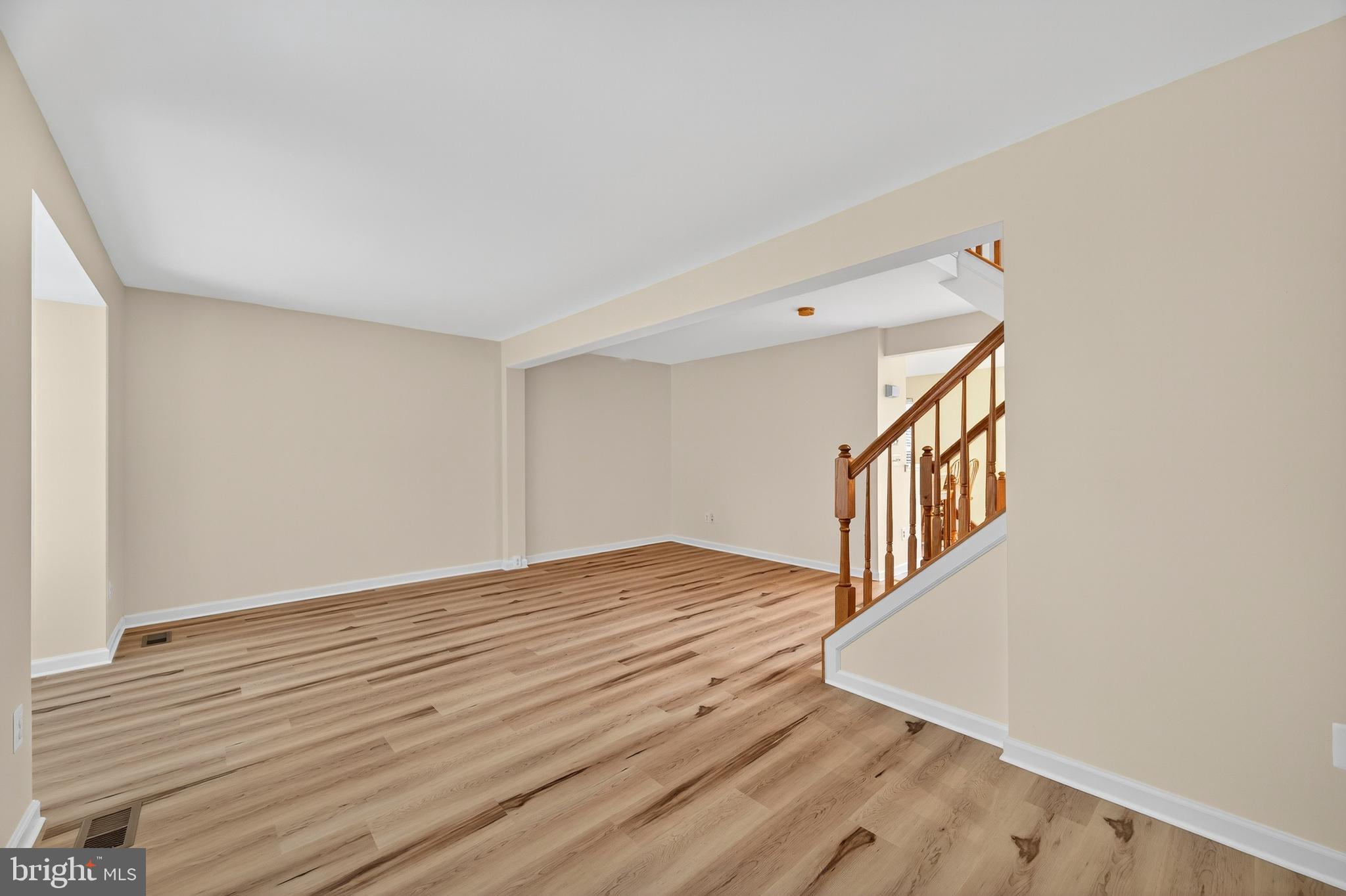 1337 Steed Street Ranson, WV 25438 - Photo 13 of 42 a view of an empty room with wooden floor