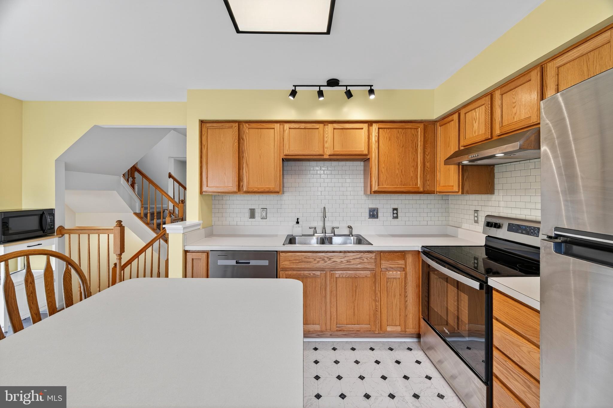 1337 Steed Street Ranson, WV 25438 - Photo 16 of 42 a kitchen with a sink a stove and cabinets