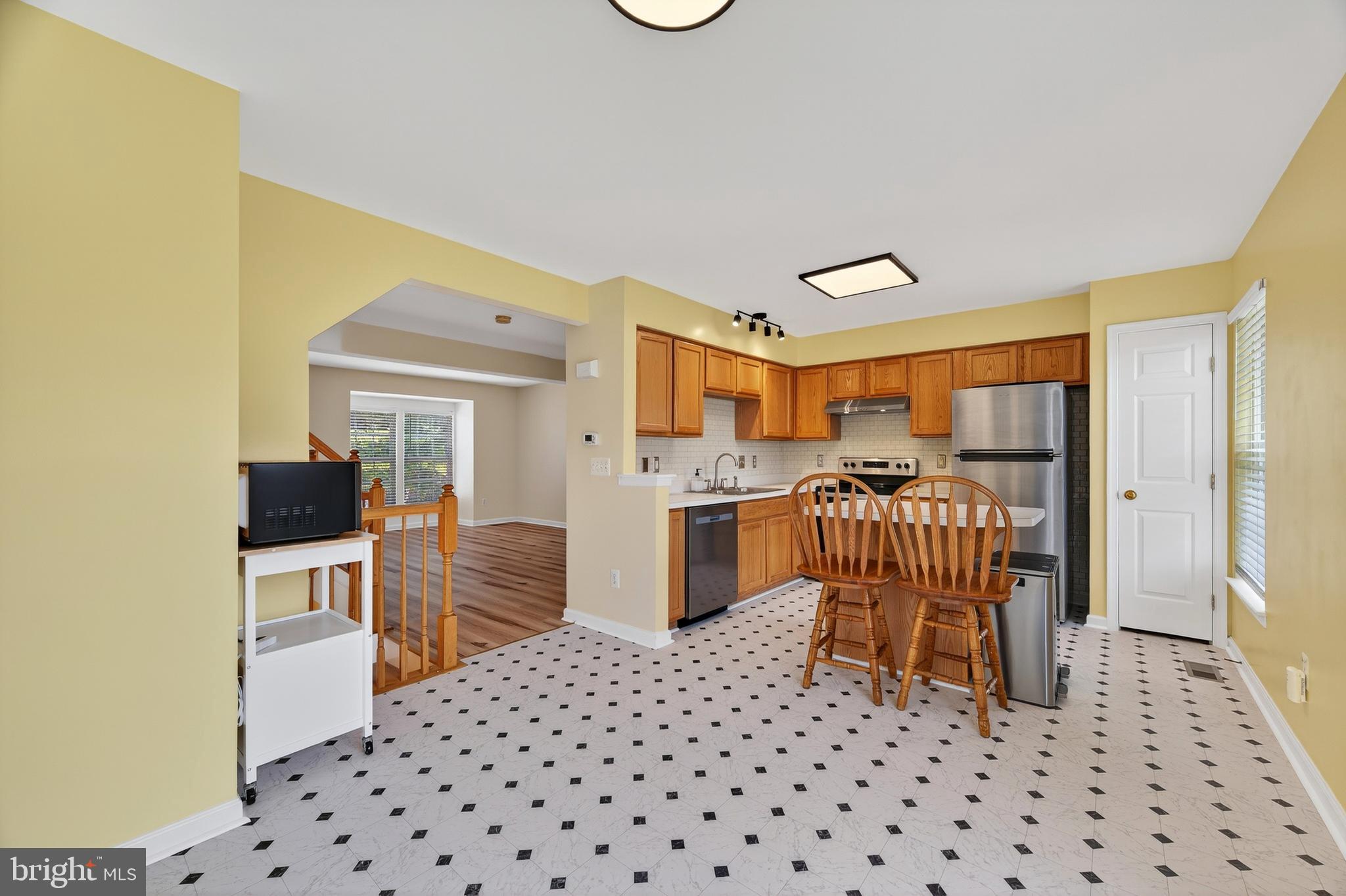 1337 Steed Street Ranson, WV 25438 - Photo 17 of 42 a bedroom with a bed and wooden cabinets