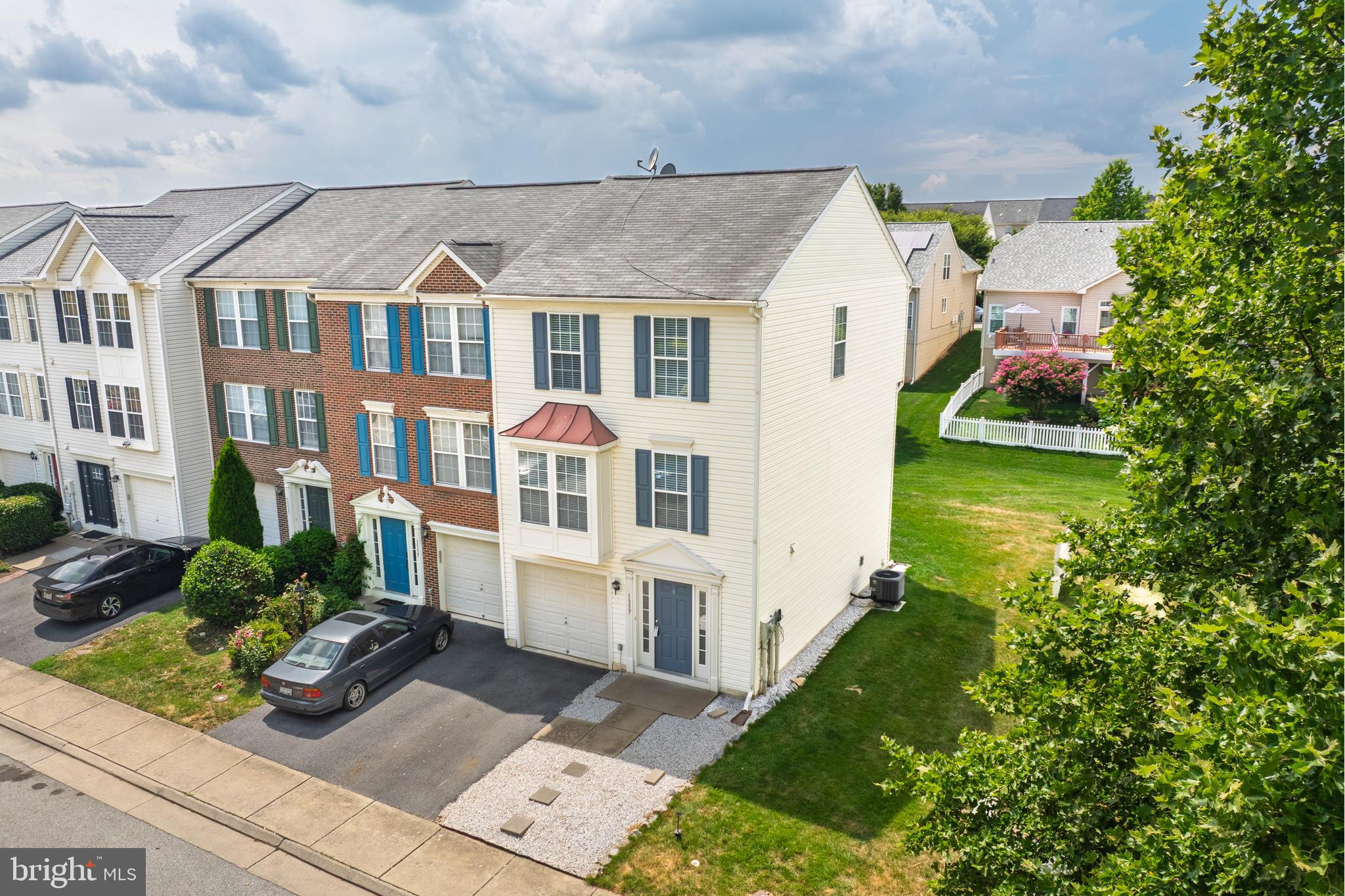 1337 Steed Street Ranson, WV 25438 - Photo 2 of 42 a front view of a house with garden