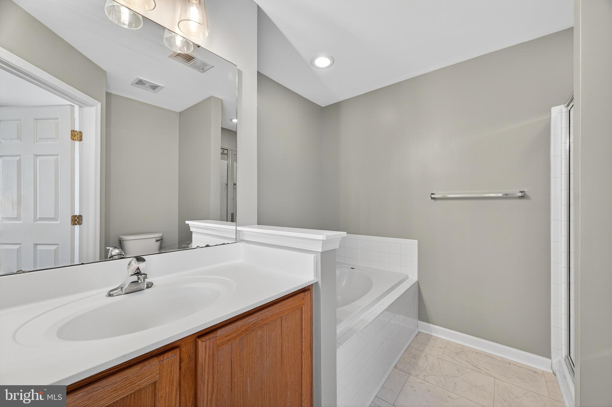 1337 Steed Street Ranson, WV 25438 - Photo 22 of 42 a bathroom with a sink and a mirror