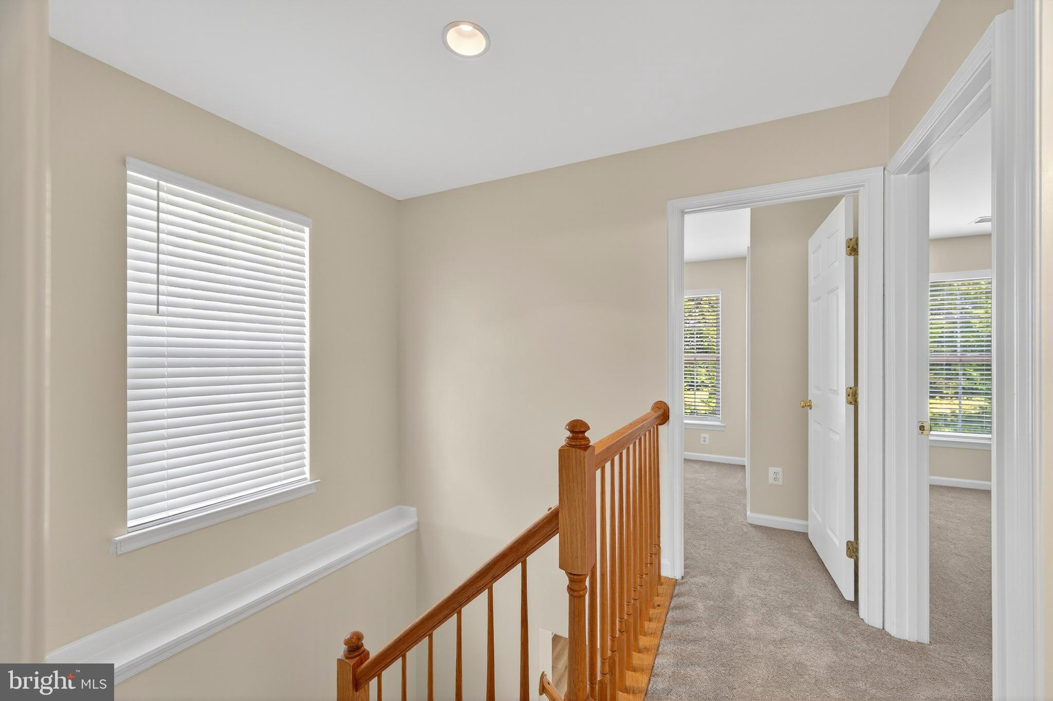 1337 Steed Street Ranson, WV 25438 - Photo 24 of 42 a view of a hallway with windows and stairs