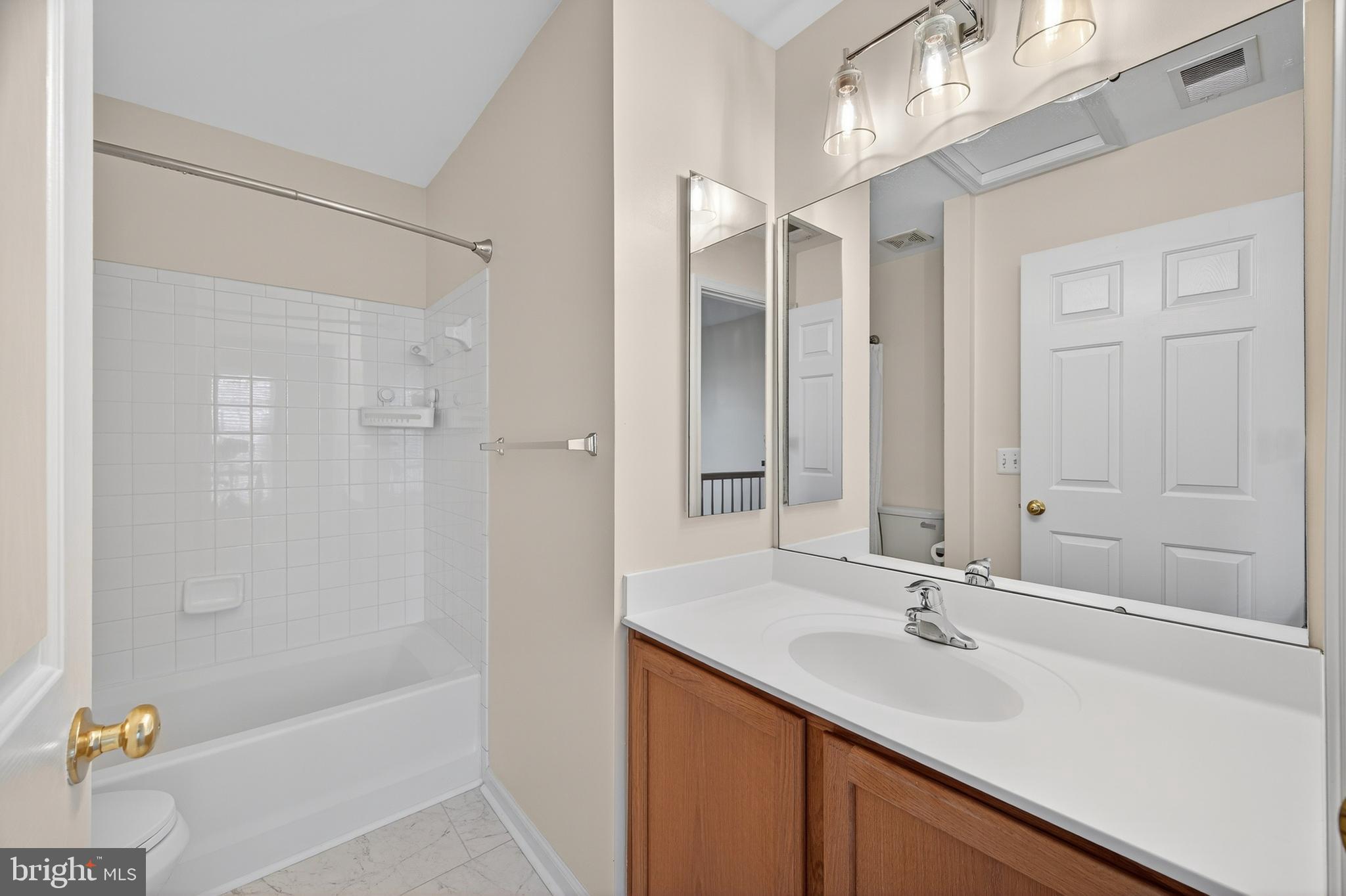 1337 Steed Street Ranson, WV 25438 - Photo 25 of 42 a bathroom with a sink double vanity granite tub shower and a mirror