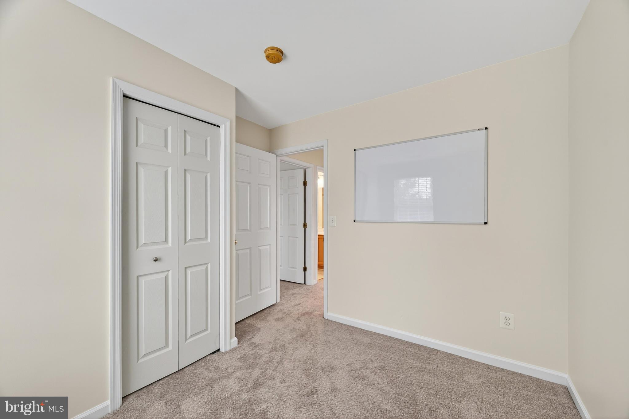 1337 Steed Street Ranson, WV 25438 - Photo 29 of 42 an empty room with a door
