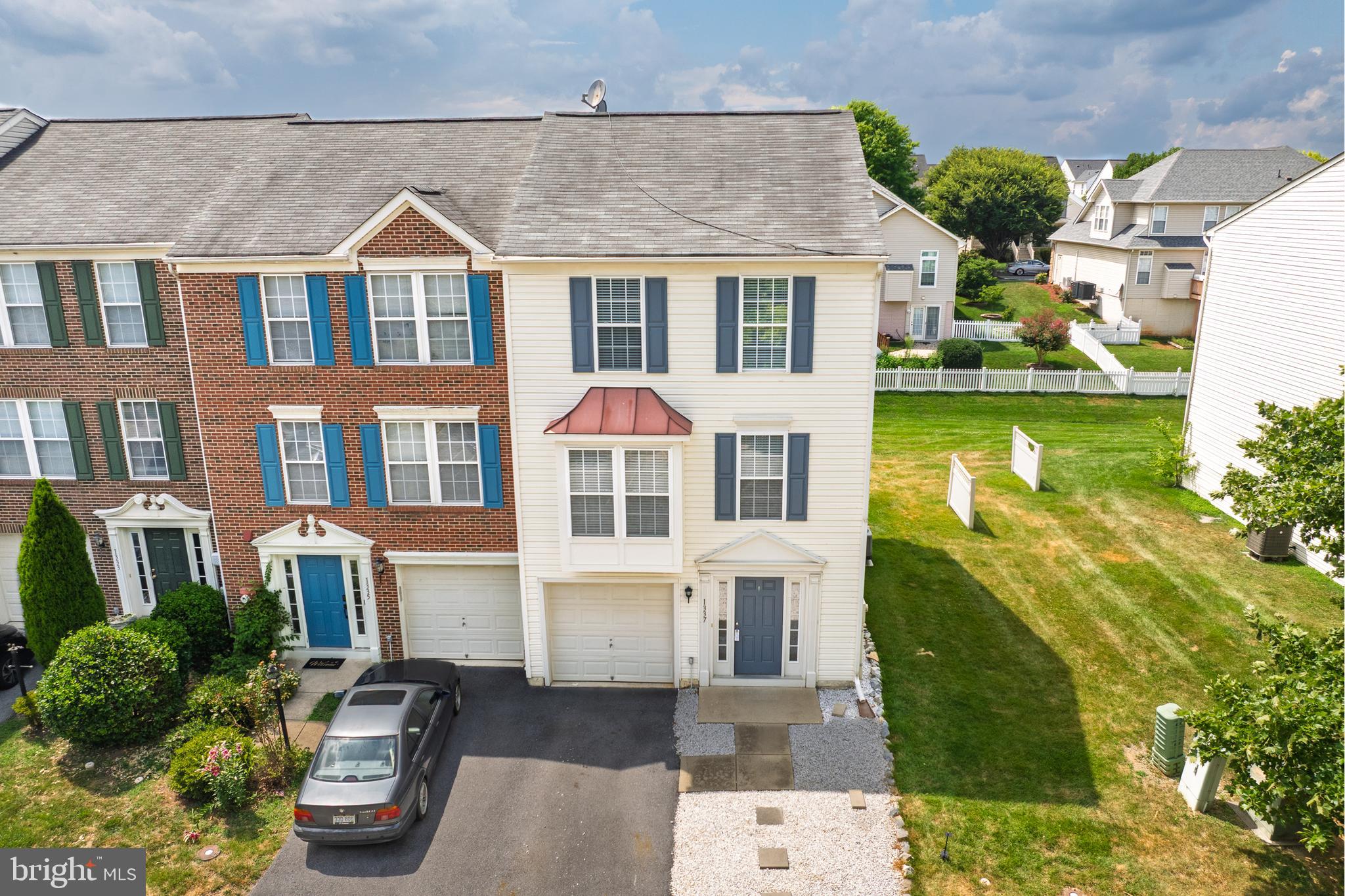 1337 Steed Street Ranson, WV 25438 - Photo 33 of 42 a view of a patio with couches chairs potted plants and water view